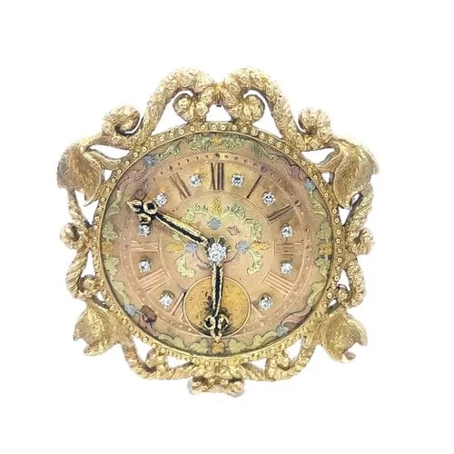 RETRO DIAMOND GOLD CLOCK PENDANT/PIN 18K 13K SCROLL FRAME LARGE: RETRO DIAMOND GOLD CLOCK PENDANT/PIN 18K 13K SCROLL FRAME LARGE This large retro era pendant and pin combined is crafted from 18k and 13k yellow gold with green, rose and white gold accent. The 40mm r