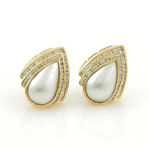CHARLES KRYPELL DIAMOND GOLD EARRING PEARL 18K YELLOW GOLD POST CLIP: CHARLES KRYPELL DIAMOND GOLD EARRING PEARL 18K YELLOW GOLD POST CLIP The Charles Krypell Diamond Gold Earring features a natural white pear-shaped diamond as the main stone, set in 18k yellow gold wit
