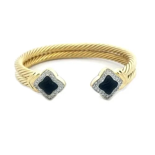 YURMAN QUATREFOIL GOLD CUFF BRACELET DIAMOND ONYX DOUBLE CABLE BAND: YURMAN QUATREFOIL GOLD CUFF BRACELET DIAMOND ONYX DOUBLE CABLE BAND This classic David Yurman Quatrefoil gold cuff bracelet is a luxurious piece of fine jewelry featuring a beautiful quatrefoil shape 