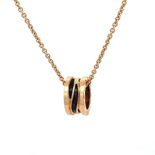 BULGARI B. ZERO1 18K ROSE GOLD BLACK CERAMIC MINI PENDANT NECKLACE BOX CERT: BULGARI B. ZERO1 18K ROSE GOLD BLACK CERAMIC MINI PENDANT NECKLACE BOX CERT Elegant and authentic from the B.Zero1 Collection by Bulgari, this mini pendant and chain is finely crafted from 18k rose go