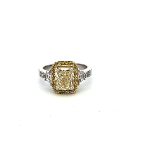 18K TWO TONE GOLD RING WITH 3.24 CARAT RADIANT CUT GIA DIAMOND SIZE 10: 18K TWO TONE GOLD RING WITH 3.24 CARAT RADIANT CUT GIA DIAMOND SIZE 10 Detailed Description: Step up your style game with this vintage and estate engagement ring, featuring a stunning 3.24-carat radia