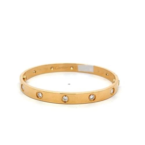 CARTIER 18 KARAT YELLOW GOLD LOVE BRACELET 0.96 CARAT ROUND DIAMONDS SIZE 17: CARTIER 18 KARAT YELLOW GOLD LOVE BRACELET 0.96 CARAT ROUND DIAMONDS SIZE 17 CARTIER 18 KARAT YELLOW GOLD LOVE BRACELET 0.96 CARAT ROUND DIAMONDS SIZE 17 PRODUCT DESCRIPTION Designer: CARTIER Detailed