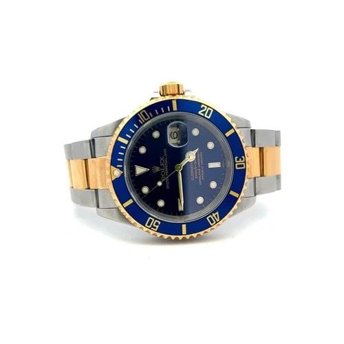 ROLEX SUBMARINER 18K GOLD STEEL BLUE DIAL REFERENCE 16613 BOX AND PAPER: ROLEX SUBMARINER 18K GOLD STEEL BLUE DIAL REFERENCE 16613 BOX AND PAPER PRODUCT DESCRIPTION Designer: ROLEX Title: Rolex Submariner 18K Gold Steel Blue Dia Marked/Tested: Model #16613 Condition: Vinta