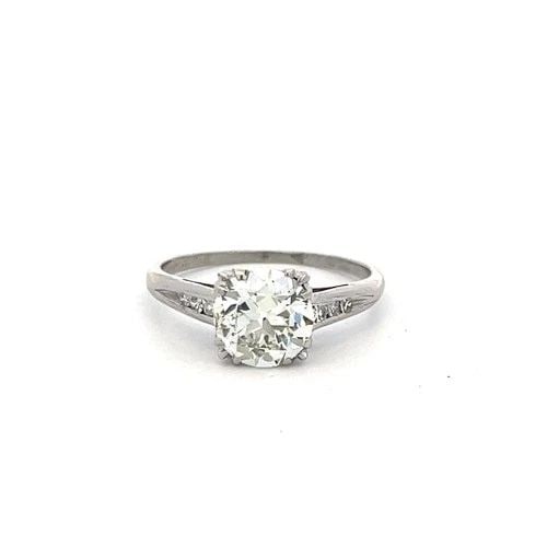 1.84 CARAT CIRCULAR BRILLIANT CUT K VS1 DIAMOND PLATINUM ENGAGEMENT RING: 1.84 CARAT CIRCULAR BRILLIANT CUT K VS1 DIAMOND PLATINUM ENGAGEMENT RING Title: This elegant vintage engagement ring showcases a stunning 1.76 carat circular brilliant cut diamond graded K color and V