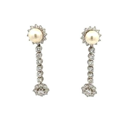 7.00 CARAT ROUND BRILLIANT G VS1 DIAMOND 14K WHITE GOLD DANGLING EARRINGS: 7.00 CARAT ROUND BRILLIANT G VS1 DIAMOND 14K WHITE GOLD DANGLING EARRINGS Title: These exquisite vintage 14K white gold dangling earrings showcase a dazzling 7.00 carats of round brilliant-cut diamond