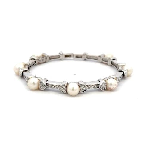 MIKIMOTO 6.6MM PEARL 0.30 CARAT ROUND DIAMOND 18K WHITE GOLD CUFF BRACELET: MIKIMOTO 6.6MM PEARL 0.30 CARAT ROUND DIAMOND 18K WHITE GOLD CUFF BRACELET MIKIMOTO 6.6MM PEARL 0.30 CARAT ROUND DIAMOND 18K WHITE GOLD CUFF BRACELET Title: Mikimoto 1.00 Carat Pearl 0.30 Carat Round 