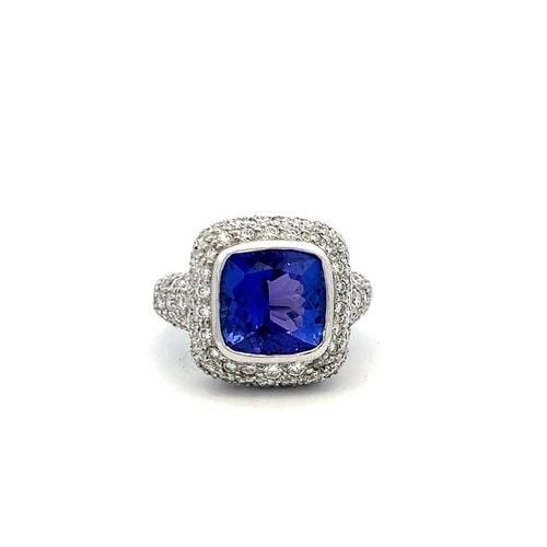 18K WHITE GOLD COCKTAIL RING WITH 7 CARAT TANZANITE 3.5 CARAT DIAMONDS SIZE 6.5: 18K WHITE GOLD COCKTAIL RING WITH 7 CARAT TANZANITE 3.5 CARAT DIAMONDS SIZE 6.5 Detailed Description: Elevate your style with this striking 18 Karat white gold cocktail ring. A vibrant 7 carat tanzani