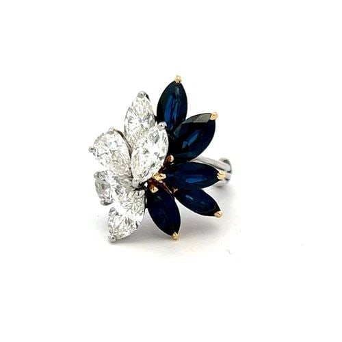 3.00CT MARQUIS SAPPHIRE & 2.50CT DIAMOND PLATINUM VINTAGE COCKTAIL RING: 3.00CT MARQUIS SAPPHIRE & 2.50CT DIAMOND PLATINUM VINTAGE COCKTAIL RING Title: This striking vintage cocktail ring features a bold floral-inspired design centered around five marquise-shaped sapphires