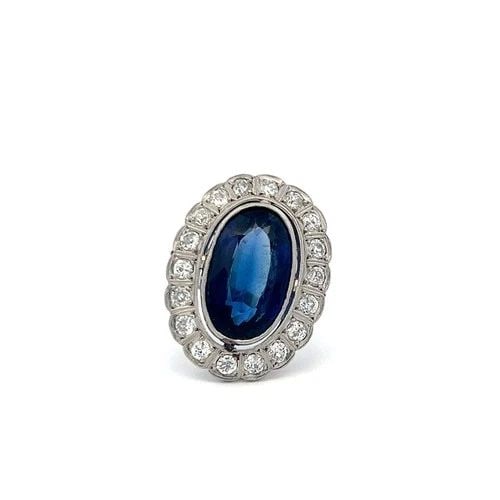 PLATINUM HALO RING WITH 1.6 CARAT DIAMONDS & 8.96 CARAT SYNTHETIC STONE SIZE 6.5: PLATINUM HALO RING WITH 1.6 CARAT DIAMONDS & 8.96 CARAT SYNTHETIC STONE SIZE 6.5 Detailed Description: Embrace timeless elegance with this luxurious vintage halo ring, meticulously crafted in platinum