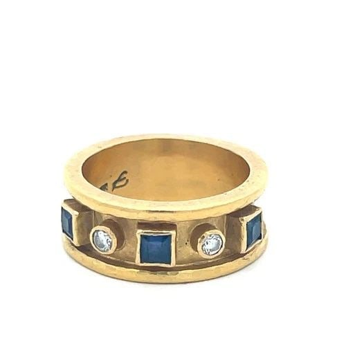 18K YG BAND RING WITH 0.46 CARAT ROUND DIAMONDS AND 0.36 CARAT SAPPHIRE SIZE 7: 18K YG BAND RING WITH 0.46 CARAT ROUND DIAMONDS AND 0.36 CARAT SAPPHIRE SIZE 7 PRODUCT DESCRIPTION Detailed Description: Elevate your style with this bold vintage 18 Karat yellow gold band, featuring 