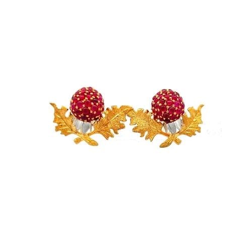 TWO TONE PLATINUM STUD EARRINGS WITH 1.4 CARAT RUBY: TWO TONE PLATINUM STUD EARRINGS WITH 1.4 CARAT RUBY Detailed Description: Vintage Estate Elevate any ensemble with these captivating two-tone platinum stud earrings, adorned with a stunning 1.4 carat 