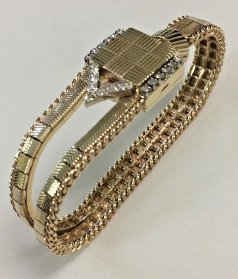 VINTAGE 14K YELLOW GOLD WOMEN'S LAYKIN WATCH WITH DIAMONDS (7 INCHES) 36.4 GRAM: VINTAGE 14K YELLOW GOLD WOMEN'S LAYKIN WATCH WITH DIAMONDS Vintage 14k Yellow Gold Laykin Watch with Diamonds You are bidding on a Vintage 14k Yellow Gold Laykin Watch with Diamonds. There are few min