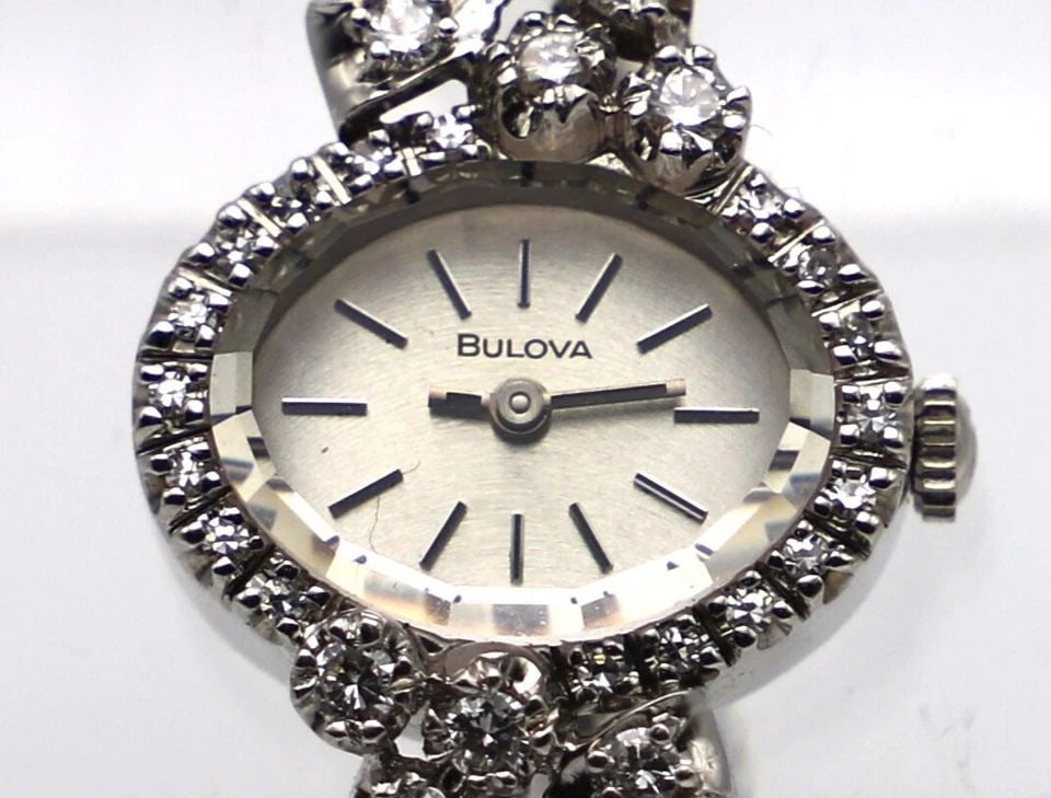 BULOVA 14K WHITE GOLD VINTAGE WATCH WITH 1.0CTW DIAMONDS 21.4 GRAMS TOTAL: BULOVA 14K WHITE GOLD VINTAGE WATCH WITH 1.0CTW DIAMONDS BULOVA 14k White Gold Vintage Watch with Diamonds You are bidding on a BULOVA 14k White Gold Vintage Watch with Diamonds. The watch has been fu