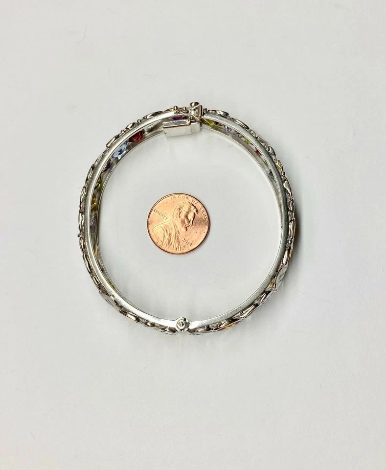 14K WHITE GOLD BANGLE WITH MULTI-COLORED NATURAL STONES 27.3 GRAMS: WOMEN’S 14K WHITE GOLD BANGLE WITH MULTIPLE NATURAL COLORED STONES Women’s 14k White Gold Bangle with Multiple Natural Colored Stones You are bidding on a pre-owned Women’s 14k White Gold Bangle