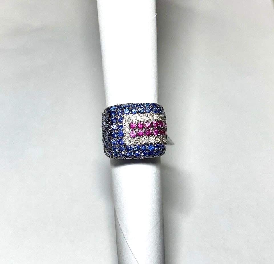 14K WHITE GOLD RING, 4.5CTS SAPPHIRES, 0.60CTS RUBIES, 0.30CTS DIAMONDS 13.7GRAM: 14K WHITE GOLD RING W/ 4.50CTS BLUE SAPPHIRE, 0.60CTS RUBIES AND 0.30CT DIAMONDS 14k White Gold Ring with 4.50CTS Blue Sapphire, 0.60CTS Rubies and 0.30CT Diamonds You are bidding on a new with tags 1