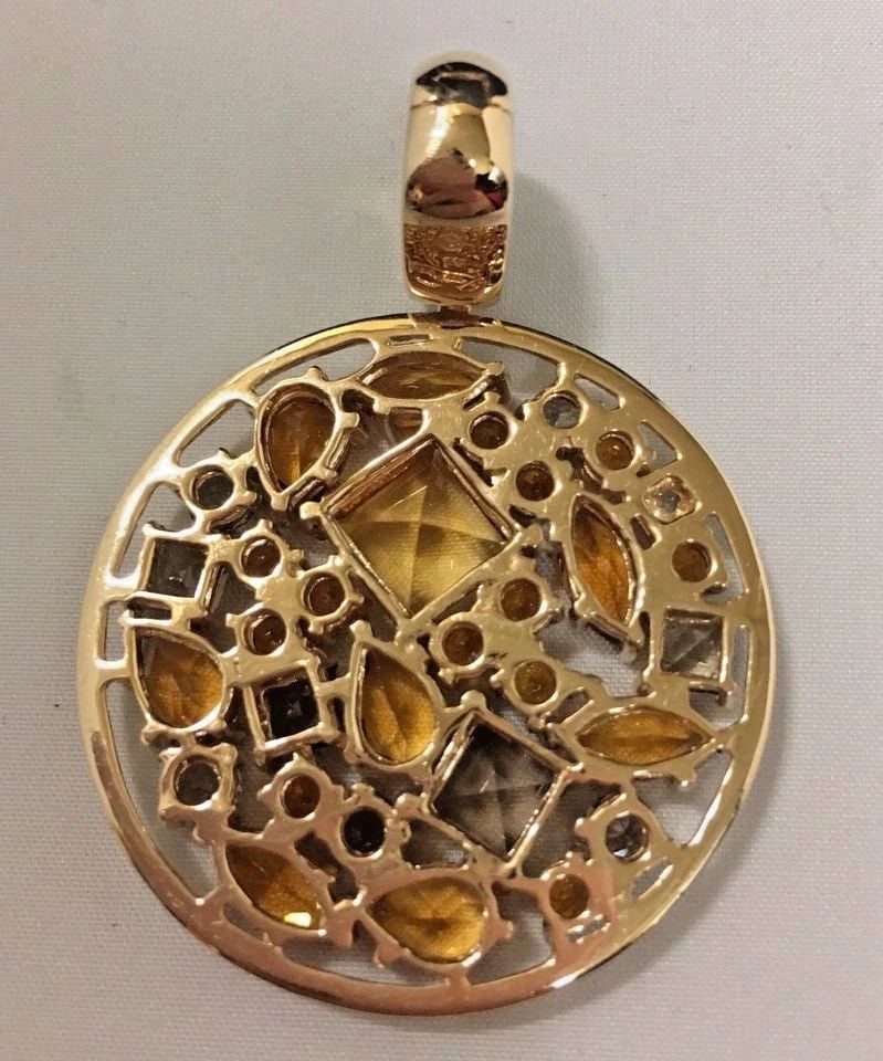 14K GOLD MULTI-COLOR STONE PENDANT, CITRINE, SMOKEY QUARTZ ( 14.8 GRAMS ): 14K GOLD MULTI COLORED STONE PENDANT WITH CITRINE AND SMOKEY QUARTZ 14k gold Multi colored stone Pendant with Citrine and Smokey Quartz You are bidding on a pre-owned 14k gold Multi colored stone Pend