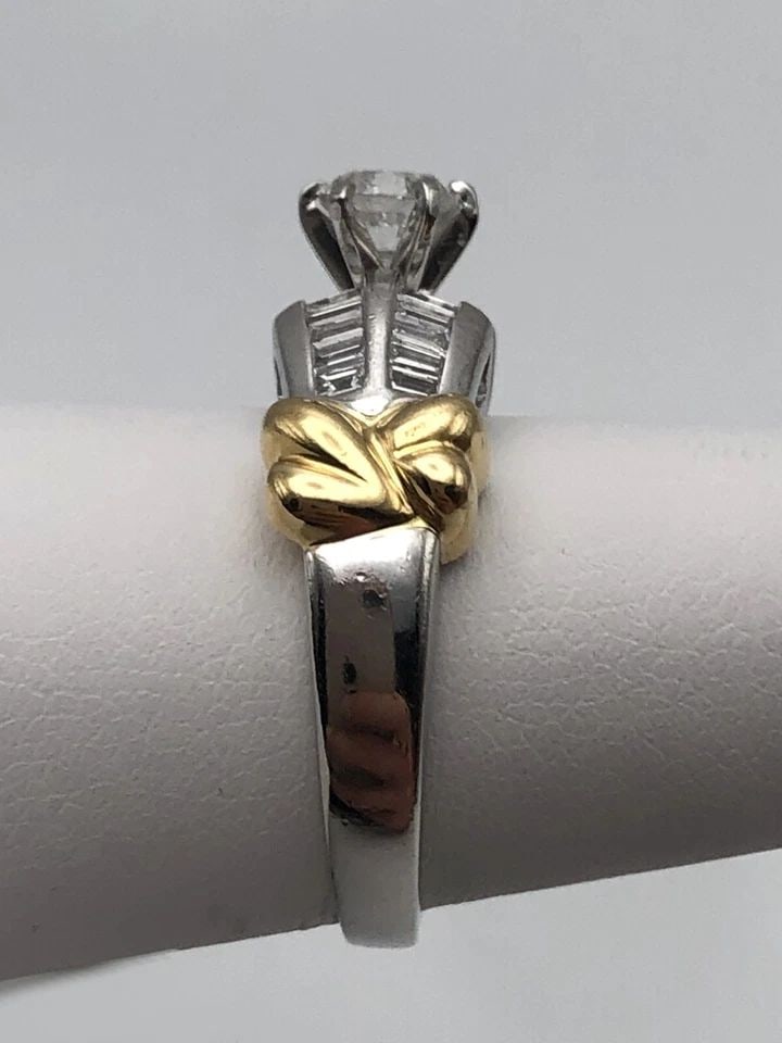 PLATINUM WITH 18KT GOLD RING, 0.57CT CENTER, 1.37CTW DIAMONDS (SIZE 6.75) 10GRAM: PLATINUM WITH 18KT GOLD RING, 0.57CT CENTER, 1.37CTW DIAMONDS SIZE: 6.75 Platinum with 18kt gold ring, 0.57ct center, 1.37ctw Diamonds Condition: Used, has been cleaned Material: Main body is 900 Plat