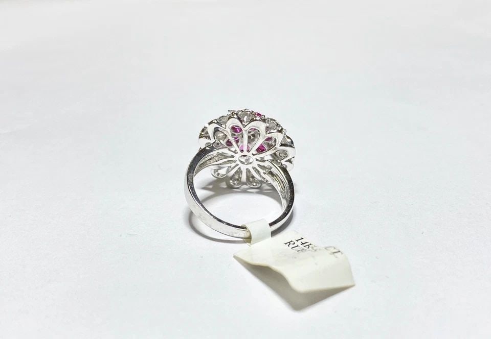 NEW WOMEN'S 14K WHITE GOLD FLOWER RING RUBY, 0.25CTS DIAMONDS (SIZE 7) 7.3GRAMS: WOMEN'S 14K WHITE GOLD FLOWER RING WITH RUBIES AND 0.25CTS DIAMONDS (SIZE 7) Women's 14k White Gold Flower Ring with Natural Rubies and 0.25CTS Diamonds (Size 7) You are bidding on a new with tags Wom