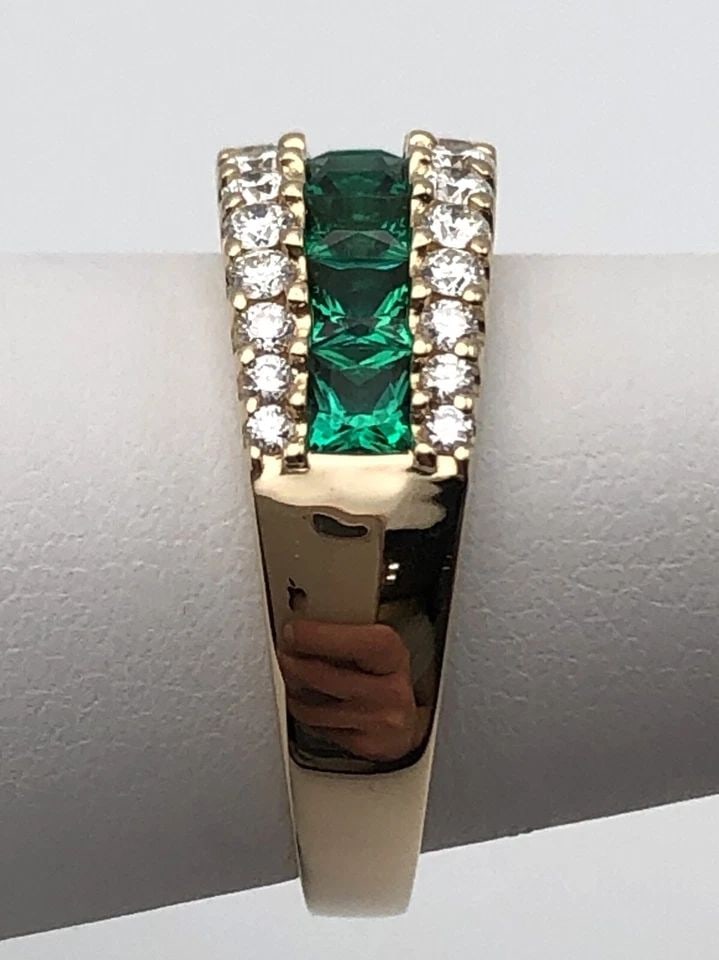 EFFY 14K GOLD BAND WITH LAB CREATED EMERALDS AND 0.70CTS NATURAL DIAMONDS SIZE 7: EFFY 14K GOLD BAND WITH LAB CREATED EMERALDS AND 0.70CTS NATURAL DIAMONDS SIZE 7 EFFY 14k Yellow Gold band with center row of Emeralds and 0.70cts of Diamonds Condition: New, Display Model, no box or 