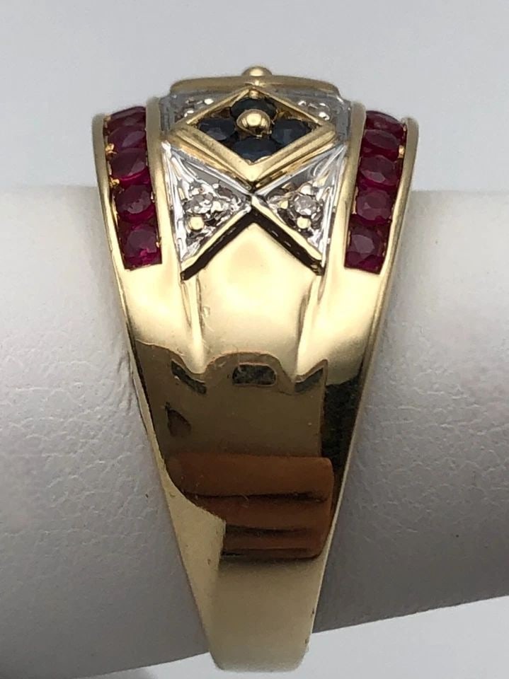 14K GOLD BAND WITH NATURAL RUBIES, SAPPHIRES AND DIAMONDS (SIZE: 9) 6.9 GRAMS: 14K GOLD BAND WITH NATURAL RUBIES, SAPPHIRES AND 0.08CTS OF DIAMONDS SIZE: 9 14k Gold Band set Rubies, Sapphires and 0.08cts of Diamonds Condition: Used Material: 14k Yellow Gold Ring Size: 9 Weight: 