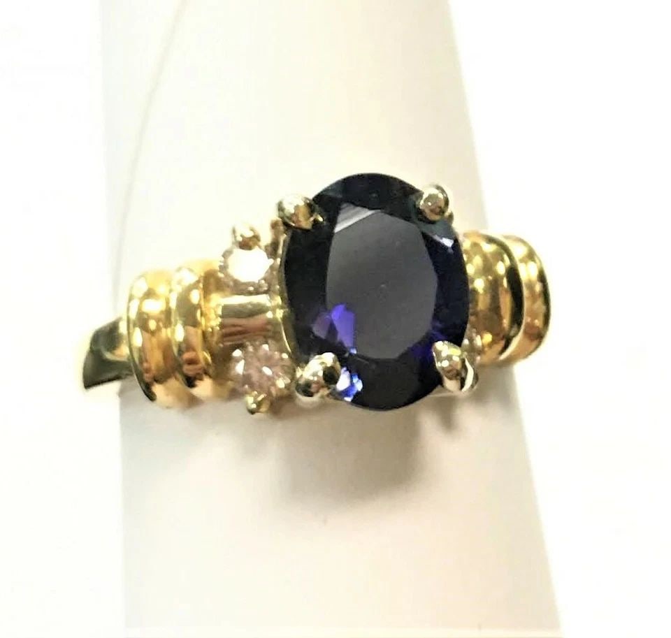 14K YELLOW GOLD RING WITH 1.46CT IOLITE AND 0.20CTW DIAMONDS (SIZE 6.75) 5.8G: 14K YELLOW GOLD RING WITH IOLITE CENTER STONE AND DIAMONDS (SIZE: 6.75) 14k Yellow Gold Ring with Iolite Center Stone and Diamonds You are bidding on a 14k Yellow Gold Ring with Iolite Center Stone an