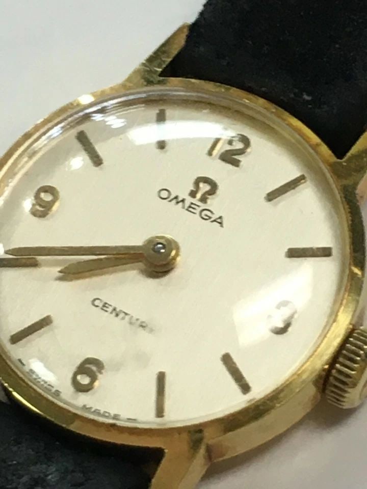 VINTAGE WOMAN'S CENTURY OMEGA 18K YELLOW GOLD WATCH: VINTAGE WOMAN'S CENTURY OMEGA 18K YELLOW GOLD WATCH Vintage Woman's Century Omega 18k Yellow Gold Watch You are bidding on a pre-owned Vintage Woman's Century Omega 18k Yellow Gold Watch. The watch ha