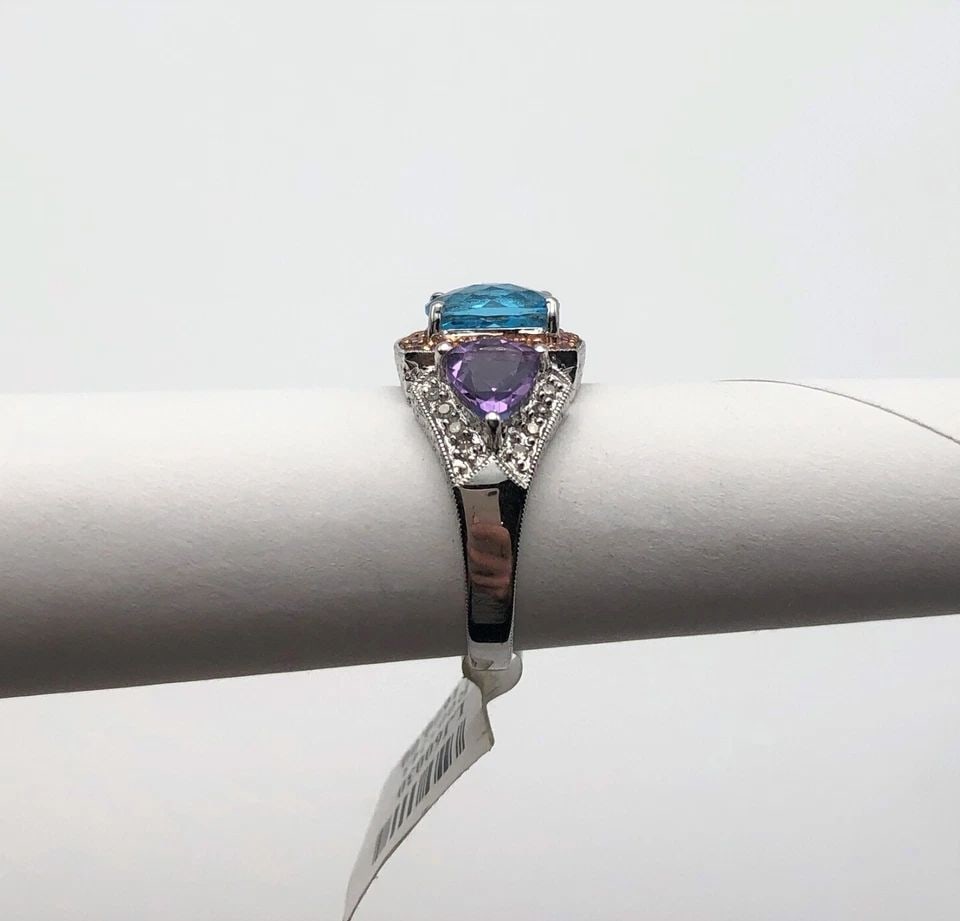 14K WHITE GOLD RING WITH AMETHYST, B. TOPAZ, PINK SAPPHIRES AND DIAMONDS 6 GRAMS: 14K WHITE GOLD RING WITH AMETHYST, BLUE TOPAZ, PINK SAPPHIRES AND DIAMONDS 14k White Gold Ring with Amethyst, Blue Topaz, Pink Sapphires and Diamonds You are bidding on a 14k White Gold Ring with Amet