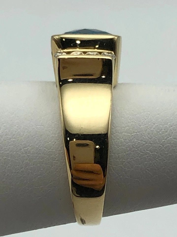 14K GOLD RING WITH SWISS BLUE TOPAZ AND 0.16CTW DIAMONDS (SIZE 6.25) 5.8 GRAM: 14k Gold Ring set with Swiss Blue Topaz and 0.16cts of Diamonds Condition: Used Material: 14k Yellow Gold Ring Size: 6.25 Weight: 5.8 grams Top Width: 8.5mm Bottom Width: 3mm Stone Info: The Swiss Blu
