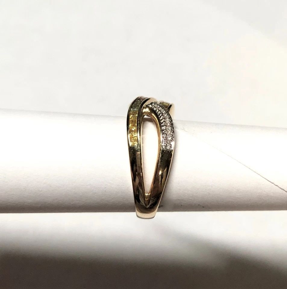 10K GOLD ART RING, SYNTHETIC SAPPHIRES, 0.12CTS DIAMONDS (SIZE 7.25) 5.4G: 10K GOLD INFINITY STYLE RING WITH SYNTHETIC SAPPHIRES AND NATURAL DIAMONDS 10k Gold Infinity style Ring with synthetic Sapphires and natural Diamonds You are bidding on a 10k Gold Infinity style Ring 