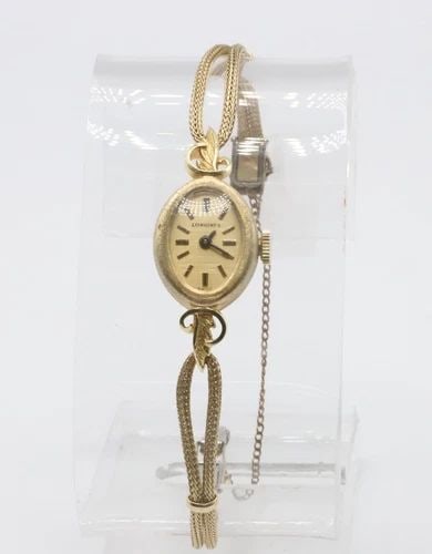 WOMAN'S VINTAGE LONGINES 14K YELLOW GOLD CASE WATCH 17 JEWELS (BAND NOT GOLD): WOMAN'S VINTAGE LONGINES 14K YELLOW GOLD WATCH 17 JEWELS Woman's Vintage Longines 14k Yellow Gold Watch 17 Jewels You are bidding on a Woman's Vintage Longines 14k Yellow Gold Watch 17 Jewels. The wat