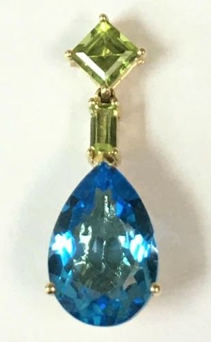 14K YELLOW GOLD DANGLE STYLE PENDANT WITH PERIDOT AND BLUE TOPAZ ( 3.9 GRAMS ): 14K YELLOW GOLD PENDANT WITH PERIDOT AND BLUE TOPAZ 14k Yellow Gold Pendant with Peridot and Blue Topaz You are bidding on a pre-owned 14k Yellow Gold Pendant with Peridot and Blue Topaz. The piece ha