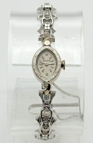 VINTAGE BULOVA WATCH 14K WHITE GOLD CASE AND STERLING BAND WITH CUBIC ZIRCONIA: VINTAGE BULOVA WATCH 14K WHITE GOLD CASE AND STERLING BAND WITH CUBIC ZIRCONIA Vintage Bulova Watch 14k White Gold Case and Sterling Band with Cubic Zirconia Condition: Used / Vintage, runs and keeps 