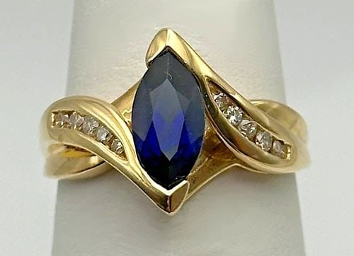 10K GOLD RING, LAB CREATED SAPPHIRE, 0.12CTS NATURAL DIAMONDS (SIZE 7) 3.6 GRAM: 10K GOLD RING WITH LAB CREATED SAPPHIRE AND 0.12CTS OF NATURAL DIAMONDS SIZE: 7 10k Gold Ring with Lab Created Sapphire and 0.12cts of natural Diamonds Condition: Used Material: 10k Yellow Gold Ring S