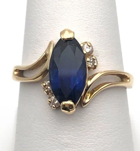14K GOLD RING WITH 2CT LAB-CREATED SAPPHIRE, 0.12CTS NATURAL DIAMONDS 3 GRAMS: 14K YELLOW GOLD RING, CENTER SYN BLUE SAPPHIRE AND 0.12CTS NATURALDIAMONDS 14k Yellow Gold Ring, center Synthetic Blue Sapphire and 0.12cts Diamonds You are bidding on a 14k Yellow Gold Ring, center S