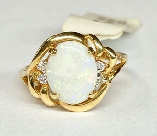 NEW 14K GOLD RING WITH NATURAL OPAL AND 0.05CTW DIAMONDS (SIZE 6) 2.6 GRAM: WOMEN'S 14K YELLOW GOLD RING WITH 10X8MM NATURAL OPAL (SIZE 6) Women's 14k Yellow Gold Ring with 10x8mm Natural Opal (Size 6) You are bidding on a new with tags Women's 14k Yellow Gold Ring with Natur