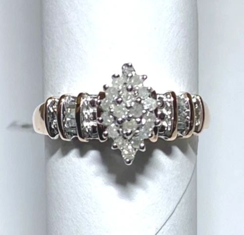 NEW 10K ROSE GOLD CLUSTER RING, 0.25CTW DIAMONDS (SIZE 7.25) 3.4 GRAMS: WOMEN'S 10K ROSE GOLD RING WITH 0.25CT DIAMONDS (SIZE 7.25) Women's 10K Rose Gold Ring with 0.25CT Diamonds (Size 7.25) You are bidding on a new with tags Women's 10K Rose Gold Ring with 0.25CT Diamon