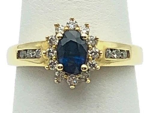10K GOLD RING WITH NATURAL SAPPHIRE AND 0.60CTW DIAMONDS (SIZE 7) 2.6 GRAM: 10K GOLD RING WITH SINGLE SAPPHIRE AND 0.60CTS DIAMONDS SIZE: 7 10k Gold Ring with single Sapphire and 0.60cts Diamonds Condition: Used Material: 10k Yellow Gold Ring Size: 7 Weight: 2.6 grams Top Wid