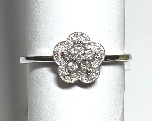 NEW 10K WHITE GOLD FLOWER RING WITH 0.14CTW DIAMONDS (SIZE 6.75) 1.2 GRAM: WOMEN'S 10K WHITE GOLD FLOWER RING WITH 0.14CT DIAMONDS (SIZE 6.75) Women's 10k White Gold Flower Ring with 0.14CT Diamonds (Size 6.75) You are bidding on a new with tags Women's 10k White Gold Flower