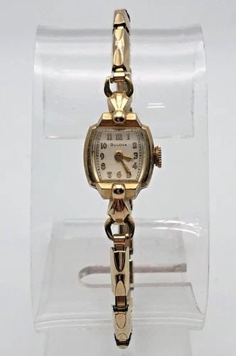 VINTAGE BULOVA WOMAN'S WATCH 10K ROLLED GOLD PLATED CASE 21 JEWELS MOVEMENT: 14K GOLD CASE VINTAGE BULOVA WOMAN'S WATCH 21 JEWELS MOVEMENT 14k Gold Case Vintage Bulova Woman's Watch 21 Jewels Movement Condition: Used vintage, running and keeps time Material: Solid 14k Yellow G