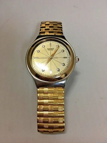SWATCH SWISS YELLOW GOLD COLOR WATCH TWO TONE 37MM CASE: SWATCH SWISS YELLOW GOLD COLOR WATCH TWO TONE CASE Swatch Swiss yellow gold color watch You are bidding on a pre-owned Swatch Swiss yellow gold color watch with two tone case. The watch is in excellen