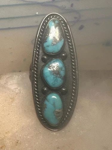 LONG TURQUOISE RING NAVAJO SIZE 5.5 STERLING SILVER WOMEN: LONG TURQUOISE RING NAVAJO SIZE 5.5 STERLING SILVER WOMEN Long turquoise ring Navajo Size 5.5 sterling silver women Size 5.50 Weight. 14.2g Length 1. 7/8" Width 3/4" Band in Back. 1/8"