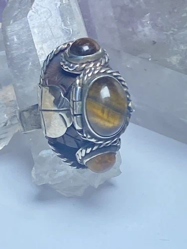 POISON RING TIGER EYE MEXICO SOLID STERLING SILVER BAND WOMEN: POISON RING TIGER EYE MEXICO SOLID STERLING SILVER BAND WOMEN Poison ring tiger eye Mexico sterling silver band women Size 7.50 Weight 11.9g Length 1" Width 13/32" Thinnest part of band 3/16"