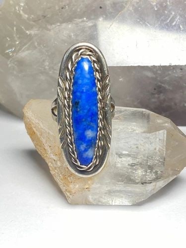 LONG BLUE LAPIS ? RING NAVAJO SOUTHWEST STERLING SILVER WOMEN: LONG BLUE LAPIS ? RING NAVAJO SOUTHWEST STERLING SILVER WOMEN Long blue lapis ? or sodalite Ring southwest sterling silver women Size 6.75 Weight 9 Length. 1 5/8" Width. 5/8" Thinnest part of band 1/8