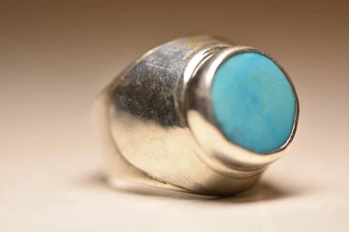 TURQUOISE RING TRIBAL BAND STERLING SILVER WOMEN MEN: TURQUOISE RING TRIBAL BAND STERLING SILVER WOMEN MEN Turquoise ring tribal band sterling silver women men Signed w a logo Size 10.75 Weight 15.4g Widest part of the band. 3/4" Thinnest part of the ban