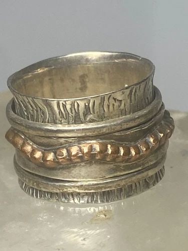 SPINNER BAND RING STACKERS BAND STERLING SILVER WOMEN GIRLS: SPINNER BAND RING STACKERS BAND STERLING SILVER WOMEN GIRLS Spinner band ring stackers band sterling silver women girls overlay detailing on dotted skinny band Size 7 Weight 8.3g Width Band 5/8"