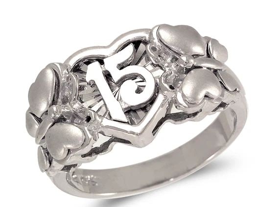 NEW 14K WHITE GOLD LADIES FANCY WHITE 15 ANOS BUTTERFLY RING: NEW 14K WHITE GOLD LADIES FANCY WHITE 15 ANOS BUTTERFLY RING LADIES FANCY WHITE 15 ANOS BUTTERFLY RING NEW 14K WHITE GOLD Apx. WIDTH: 12mm Apx. WEIGHT: 5.5g