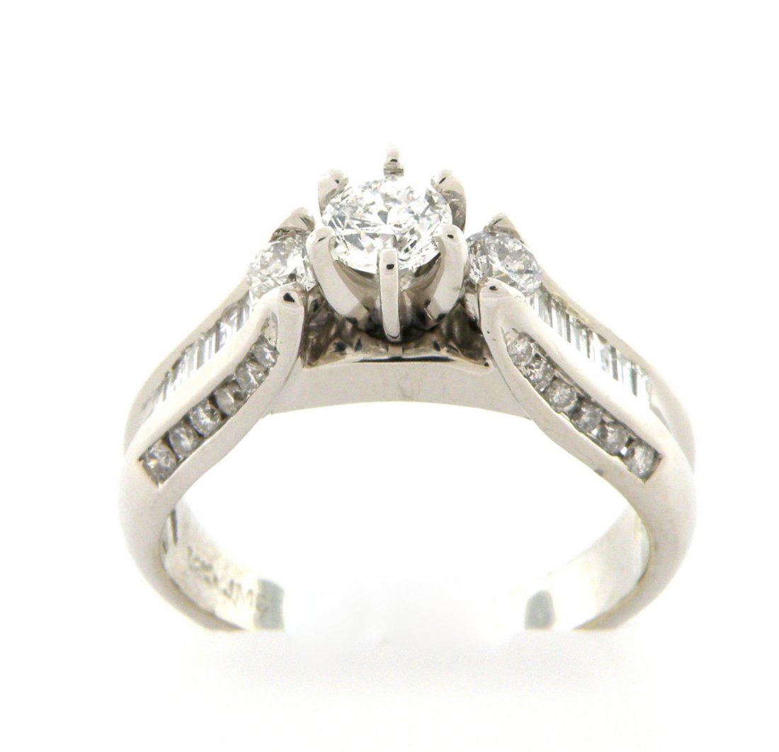 NEW 14K WHITE GOLD LADIES DIAMOND SOLITAIRE RING: Engagement RingConditionNewMaterial14k White goldStonesDiamonds Baguette & Round G-H SI1Stone Weight1ct tw - Center apx 0.35ct Size7 (we can re-size for a small fee, please contact us)Weight5.3g
