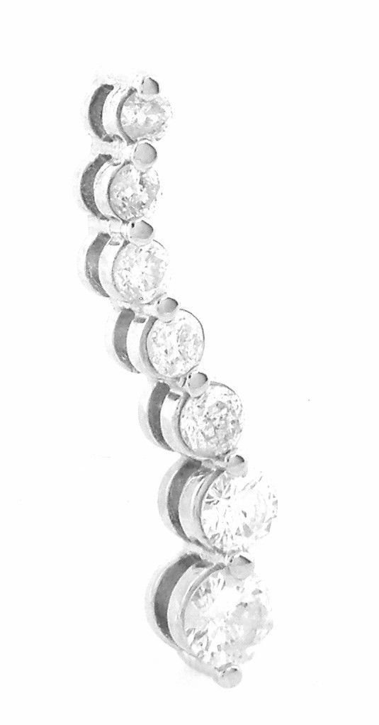 NEW 14K WHITE GOLD 7 DIAMOND JOURNEY PENDANT 0.65ct: Journey PendantConditionNewMaterial14K White goldStonesDiamonds H-I SI3Stone Weight0.65 tcwSize0.95" H x 0.19" WWeight1.2g