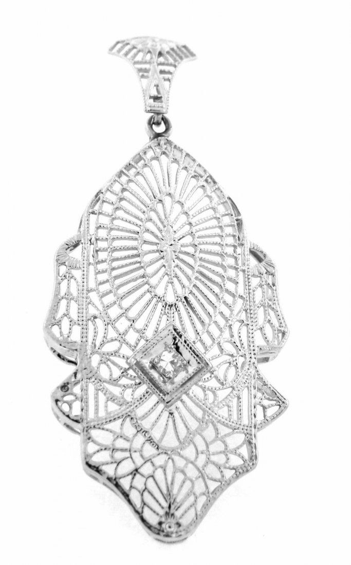 VINTAGE 14K WHITE GOLD DIAMOND PENDANT FILIGREE: Vintage PendantConditionVintage, In Excellent conditionMaterial14k Yellow goldStonesOld single cut Diamond H SI1Stone Weight0.03ctSize1.65" H X 0.73"WWeight2g