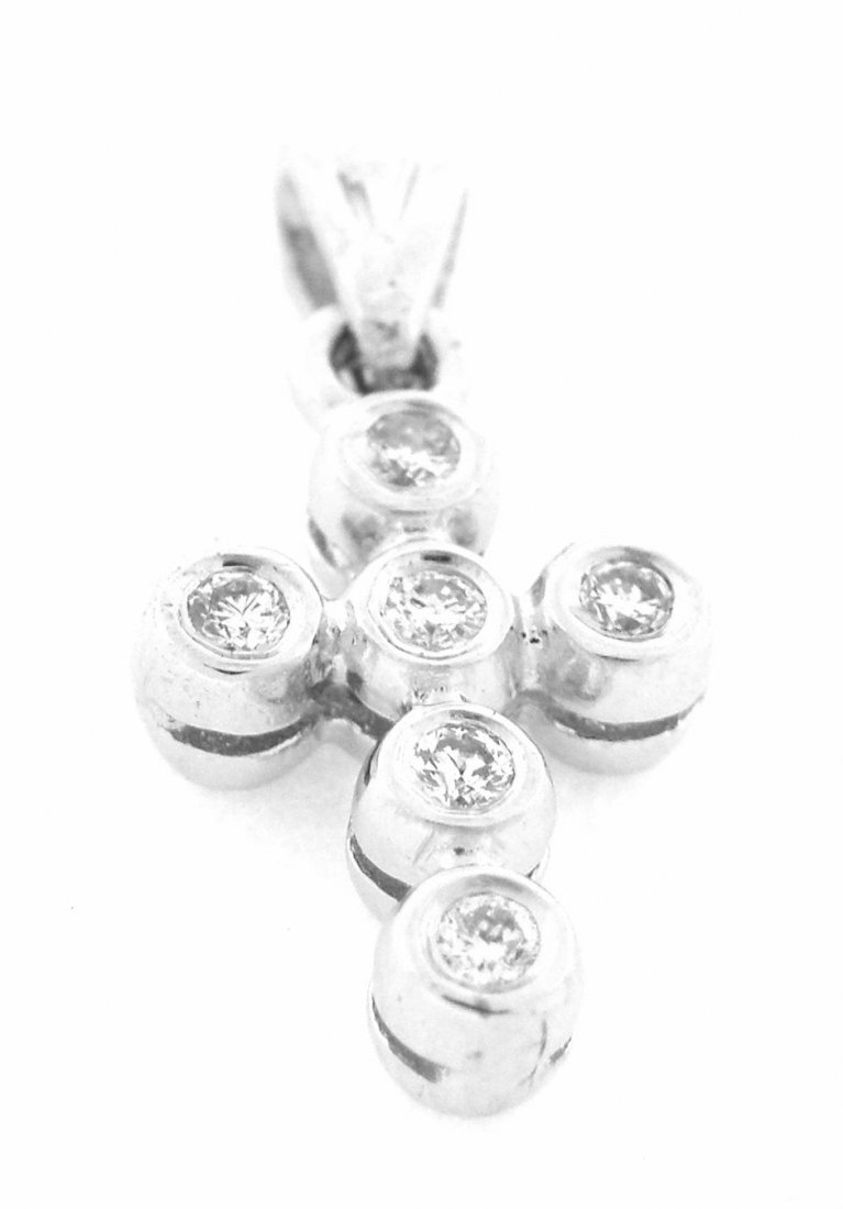 NEW 14K WHITE GOLD DIAMOND CROSS PENDANT: Cross PendantConditionNewMaterial14k White goldStonesDiamonds G SI2Stone Weight0.30ctSize0.75" H x 0.38" WWeight1.8g